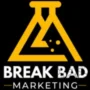 Break Bad Marketing logo: A golden-yellow letter 'M,' with three bubbles inside and a gap at the bottom of the flask. The design symbolizes 'marketing' and features a black background.